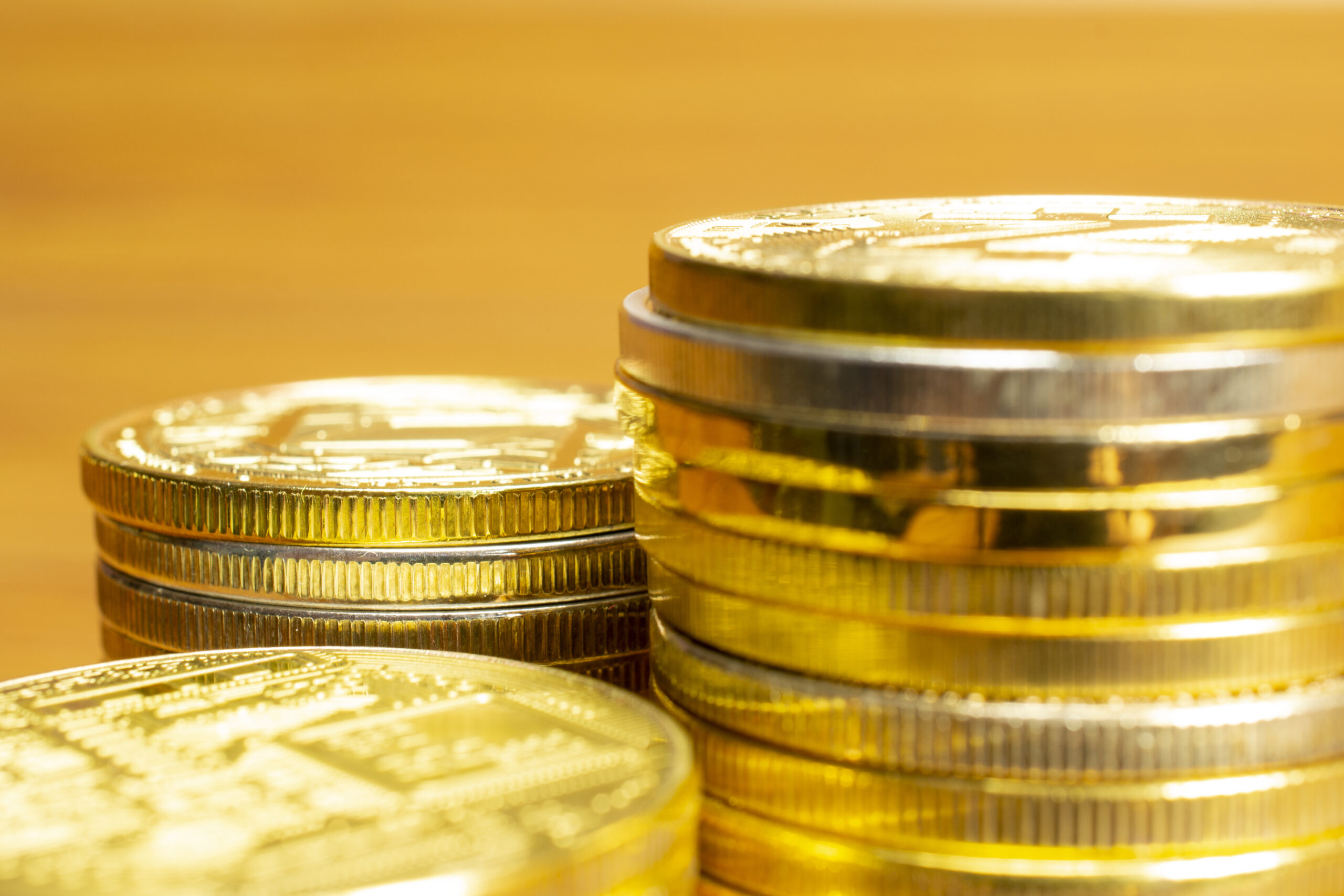 Rows, stacks of coins with blurred background, selective focus of close up view and blank space for finance and business concept.